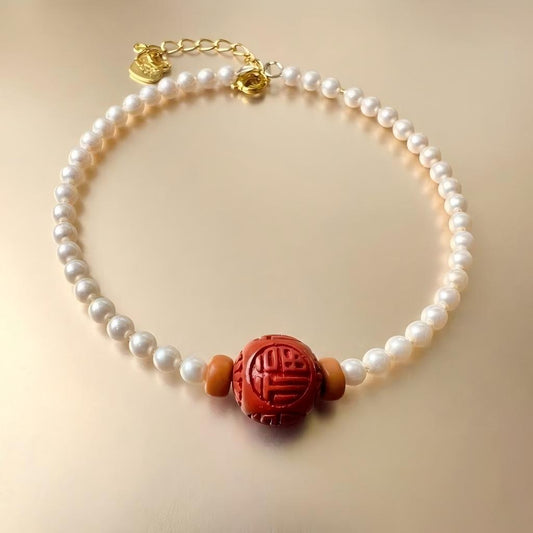 日出-Cultured Pearl and Cinnabar Lacquer Blessing Bracelet